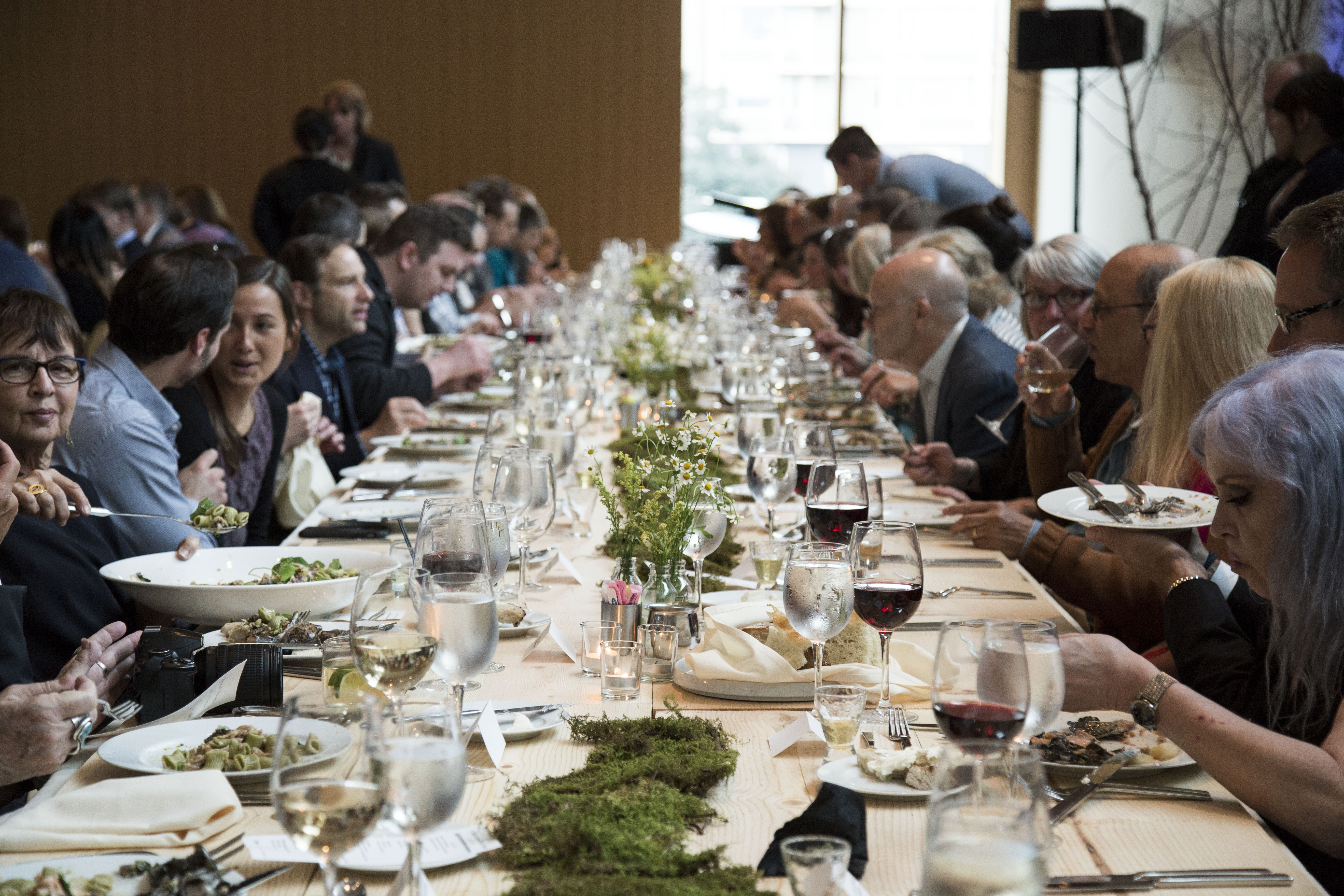 Guests dining at decorated table for a special event